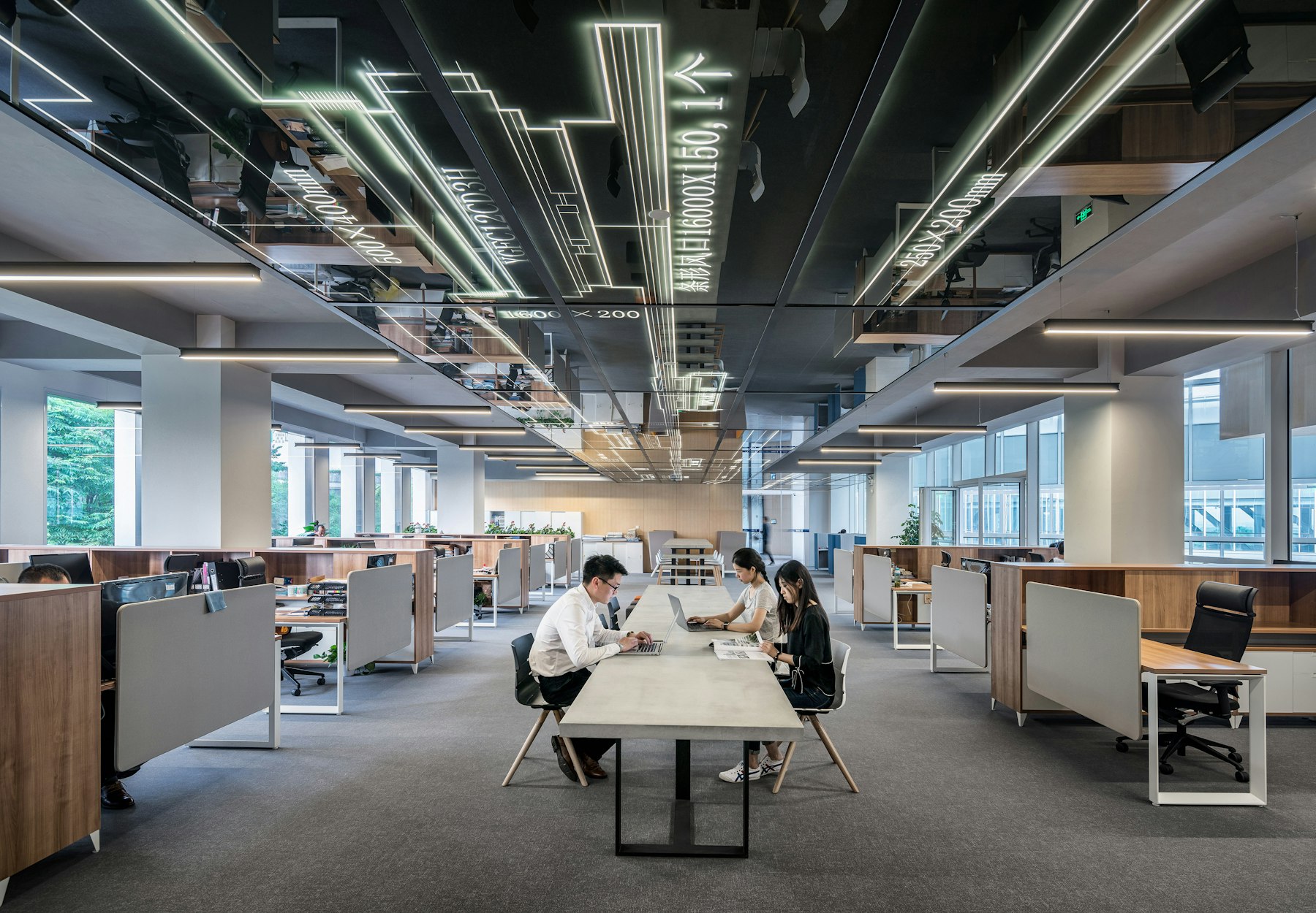 Modern enterprise workplace with open-plan technology teams