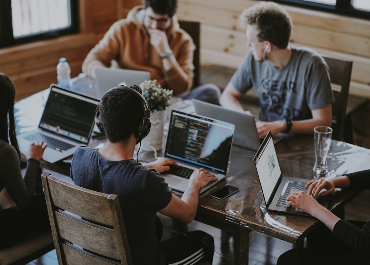 Team working together on a technology solution in an open workspace