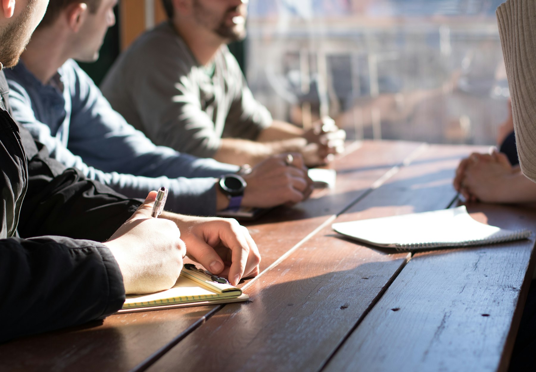 Colleagues reviewing technology plans together in a meeting room
