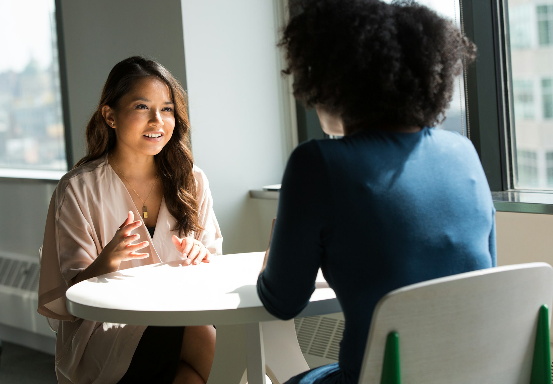 Two professionals in conversation during a recruitment interview